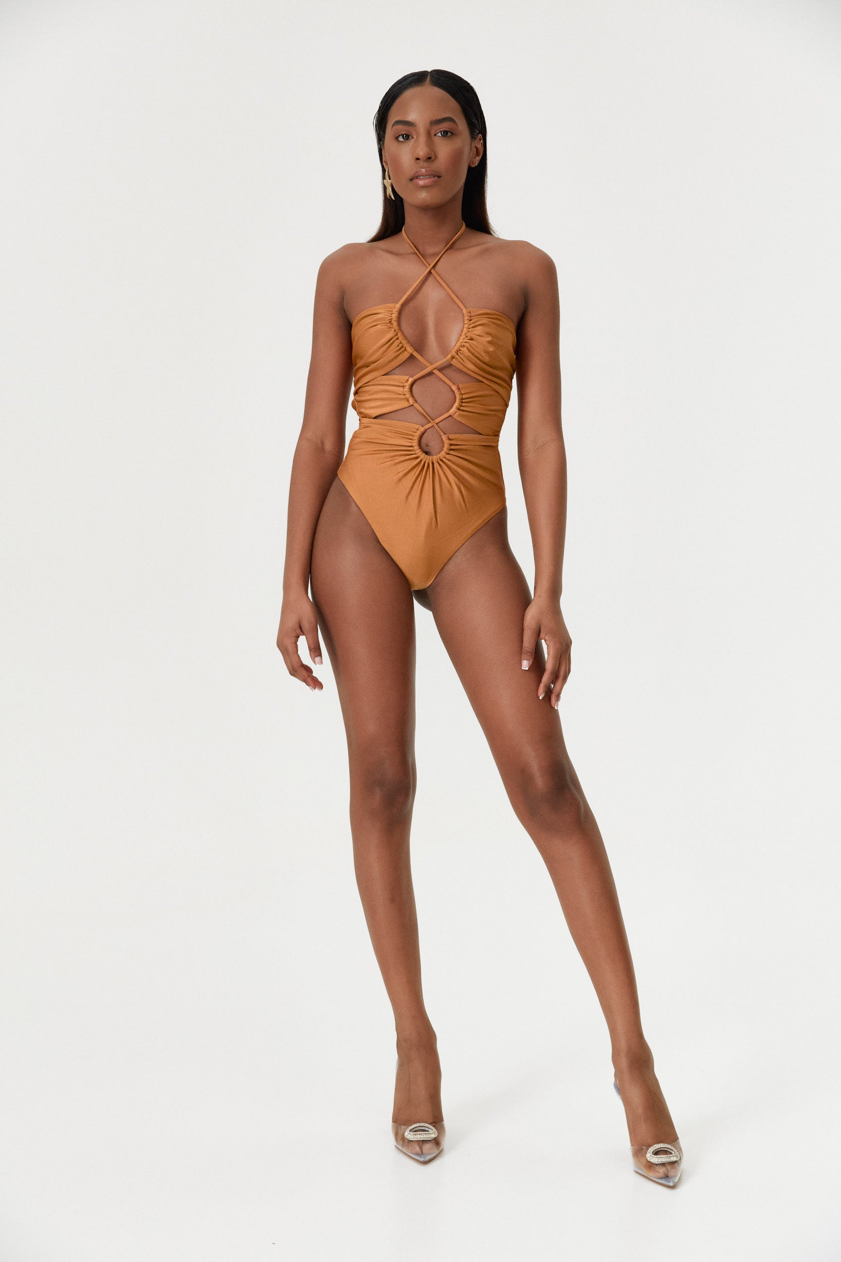 Model wearing the Amber Infinity One-Piece, facing forward to highlight the adjustable bust coverage and luxurious shine.